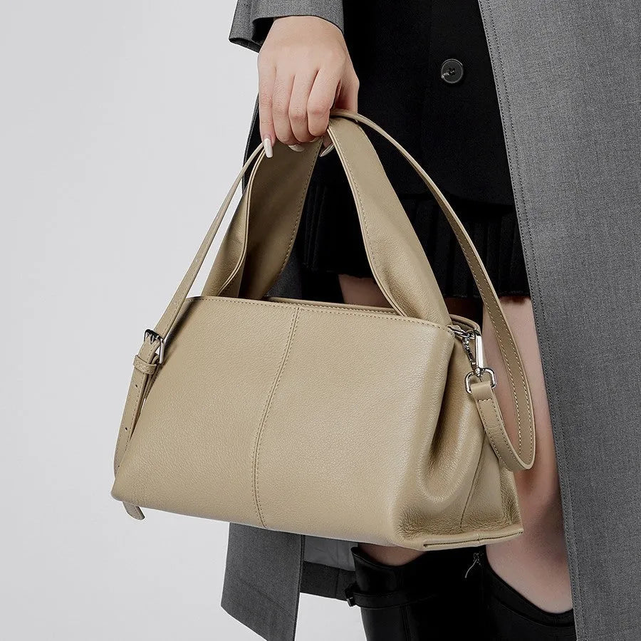 Women's genuine leather messenger bag in horizontal square shape with double shoulder straps and organised compartments