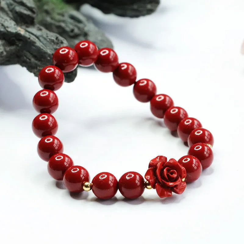 Purple gold sandstone cinnabar bracelet with 8mm rose-carved beads on wrist
