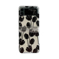 Clear Samsung Galaxy Z Flip phone case with floral pattern, available in Daisy and Tulip designs.