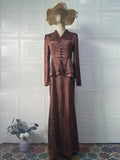 Dark brown retro dress with floral print, long sleeves, and fake two-piece design on mannequin