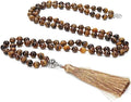 Handmade knotted beaded necklace with 108 stone pendants showing colour variations