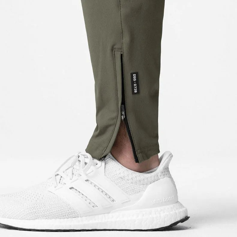 Men's grey fitness trousers with ankle-tied design, quick-drying polyester fabric for exercise