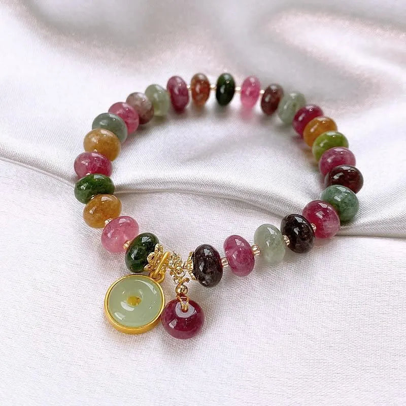 Colourful tourmaline abacus bead bracelet with rabbit pendant on natural stone beads