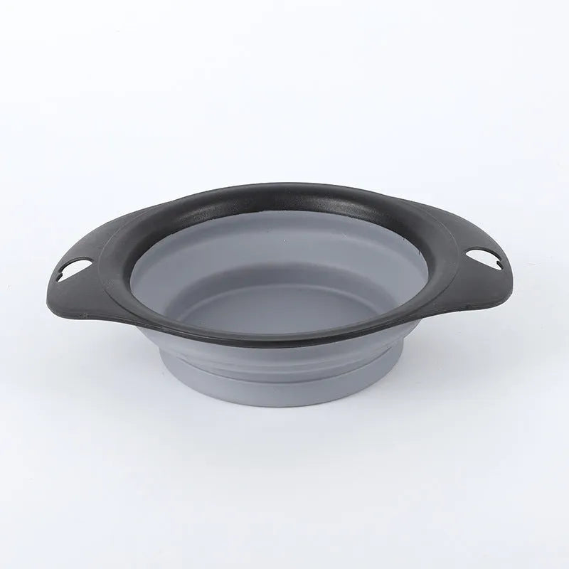 Black and green silicone pet bowls shown folded flat and unfolded ready for use.