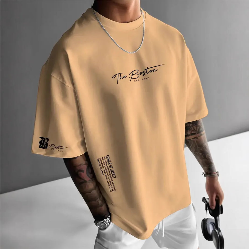 Men's loose letter print short sleeve t-shirt in polyester, round neck pullover, available in white black coral apricot.