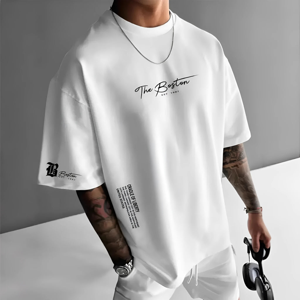 Men's loose letter print short sleeve t-shirt in polyester, round neck pullover, available in white black coral apricot.