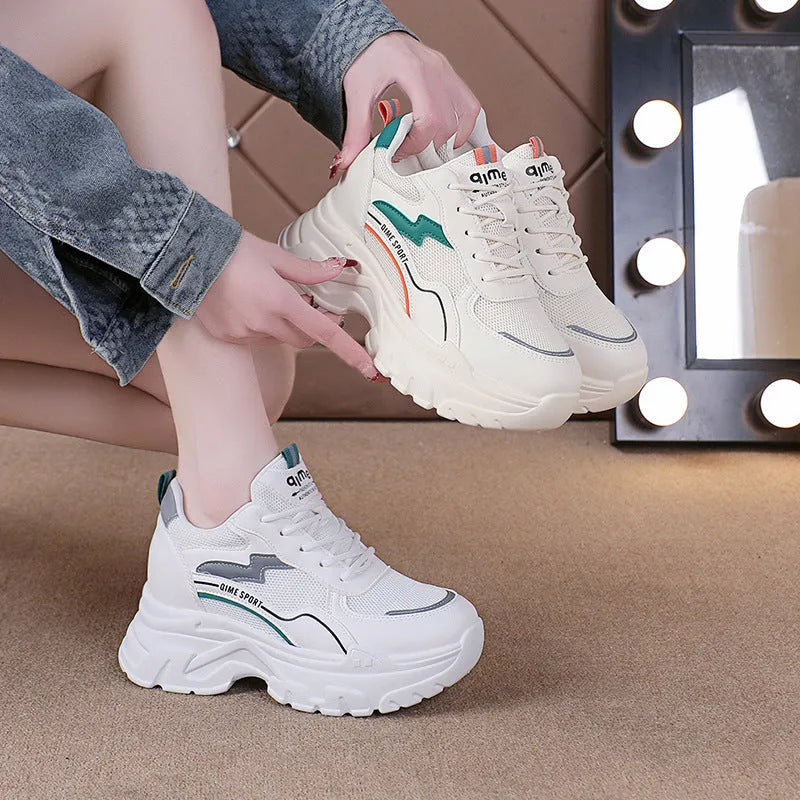 Women's low-top dad shoes in beige with cross shoulder straps, rubber sole, and breathable mesh upper
