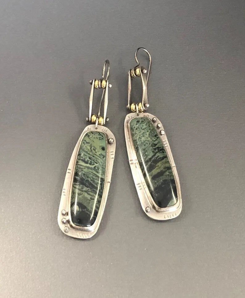 Two-tone geometric marble pattern earrings with alloy construction and post back closure