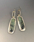Two-tone geometric marble pattern earrings with alloy construction and post back closure