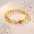 Gold rutilated quartz crystal bracelet with diamond-cut beads on stretch cord in Korean style