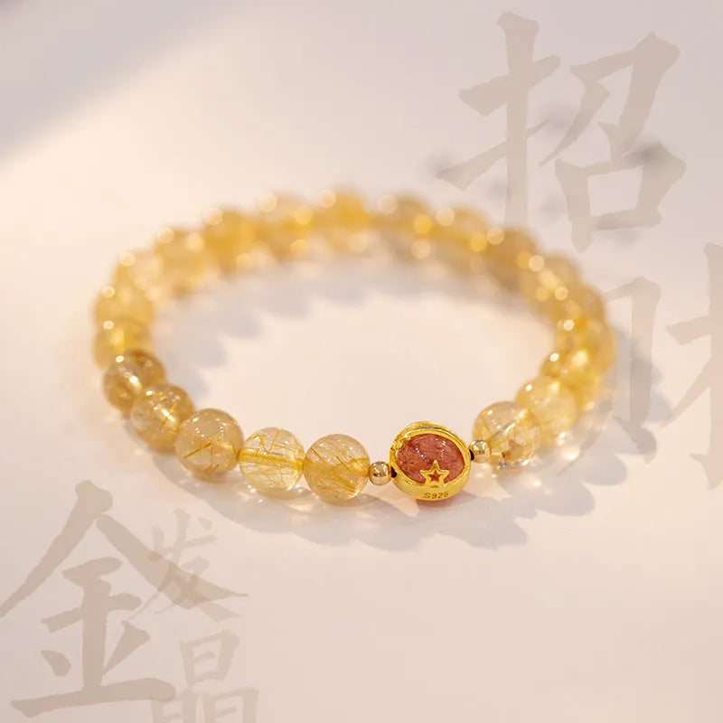 Gold rutilated quartz crystal bracelet with diamond-cut beads on stretch cord in Korean style