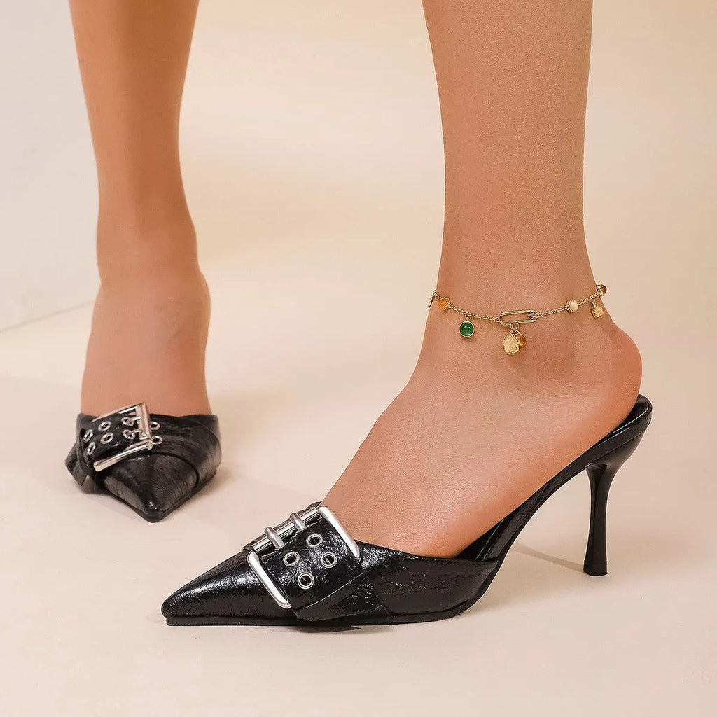 Black women's pointed toe high heels with adjustable ankle strap and decorative buckle fastening
