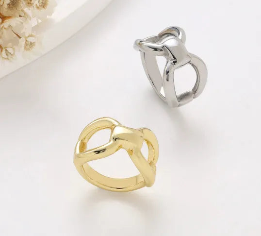 Women's geometric butterfly ring with hollow bow design in titanium steel