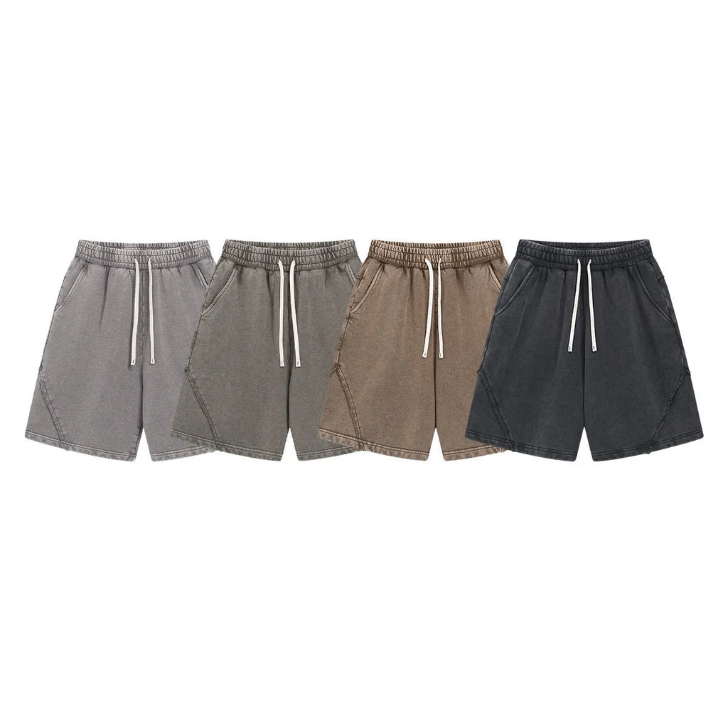 Men's loose fit retro shorts in batik washed cotton terry fabric, showing patch craft detail.