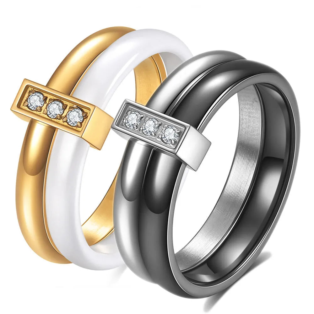 Geometric ceramic ring with zirconium inlay, available in steel black or gold white, sizes 6 to 10