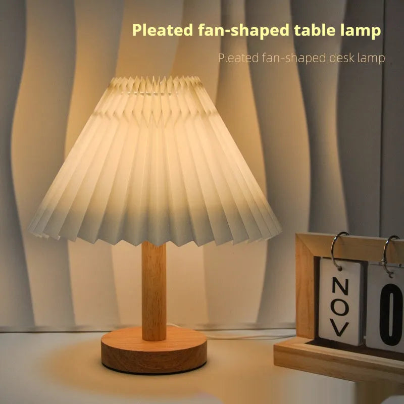 Vintage pleated umbrella-shaped bedside lamp with remote control on bedside table