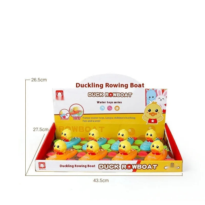 Yellow plastic wind-up swimming bath toy for children on a blue background.