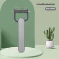 Green and grey dog unknotting combs in small and large sizes with stainless steel teeth on a PP handle.