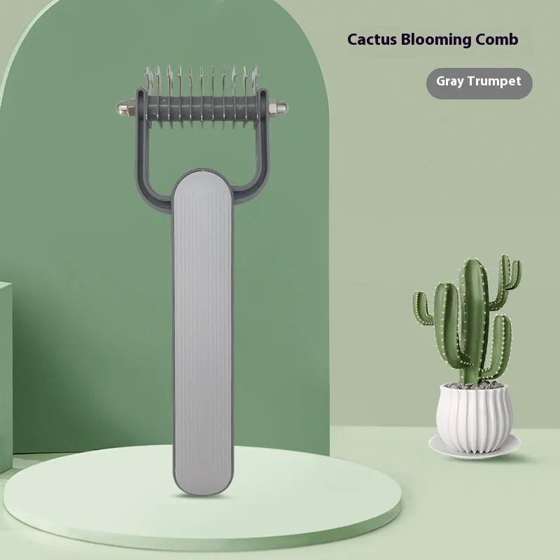 Green and grey dog unknotting combs in small and large sizes with stainless steel teeth on a PP handle.
