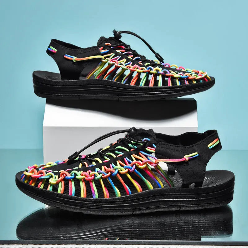 Woven sandals with elastic drawstring tie in rainbow colour, showing rubber sole and net cloth lining