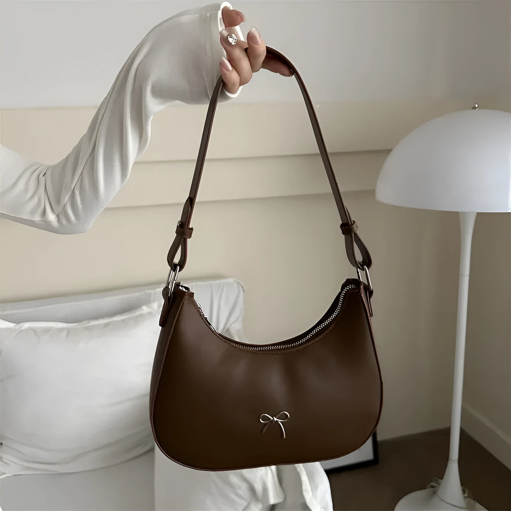 Women's PU dumpling-shaped underarm baguette handbag in six colours with a single strap.