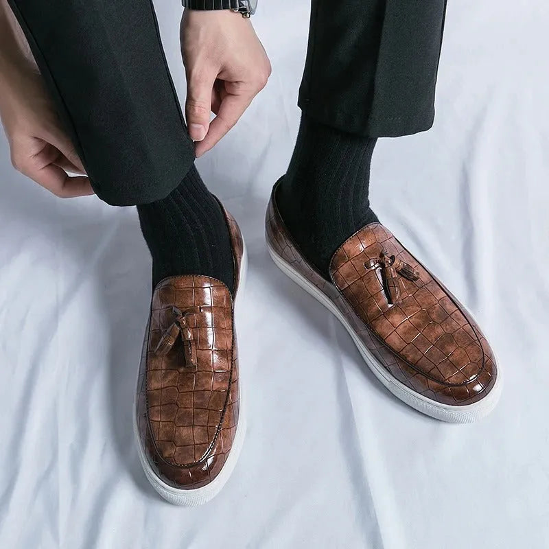 Men's black business casual sneakers with tassel detailing and round toe shape
