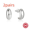 C-shaped sterling silver earring with electroplated gold finish on a stud backing