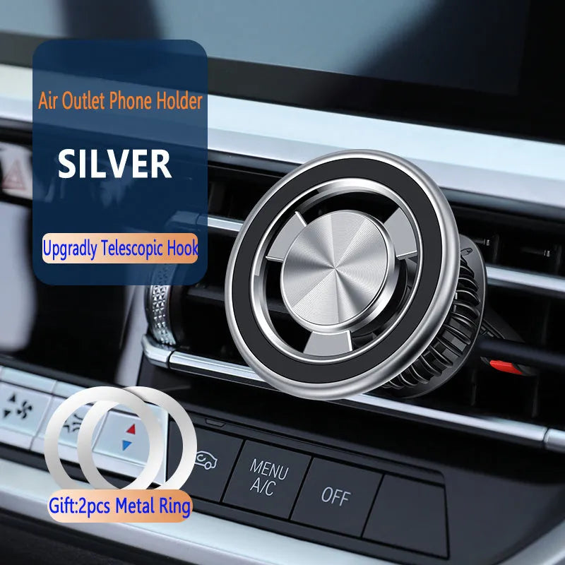 Silver magnetic phone holder attached to car air vent with phone mounted