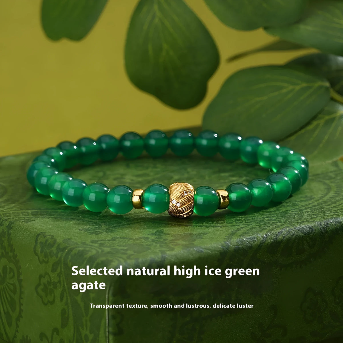 Green agate and sterling silver bracelet with yellow gold plating and a geometric bead.