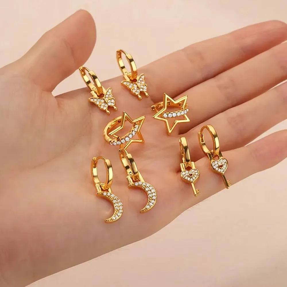 Women's irregular geometric butterfly earrings in copper with diamond treatment, showing heart-shaped and star design elements