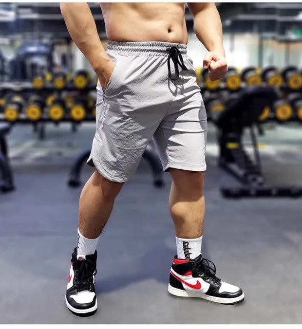 Men's quick-dry sports running shorts in black with contrast colour detailing
