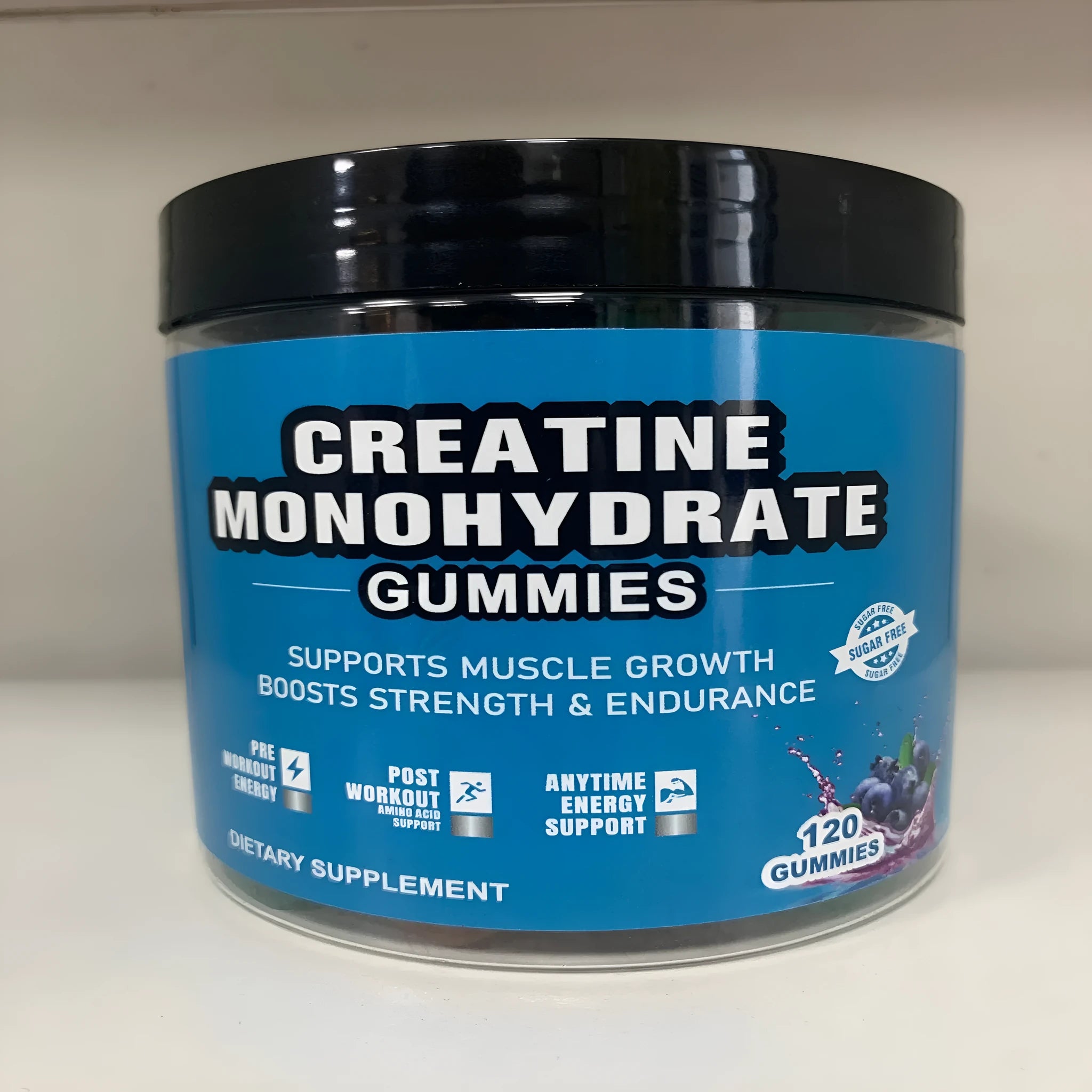 Bottle of raspberry-flavoured creatine monohydrate gummy supplements containing 120 soft candy tablets