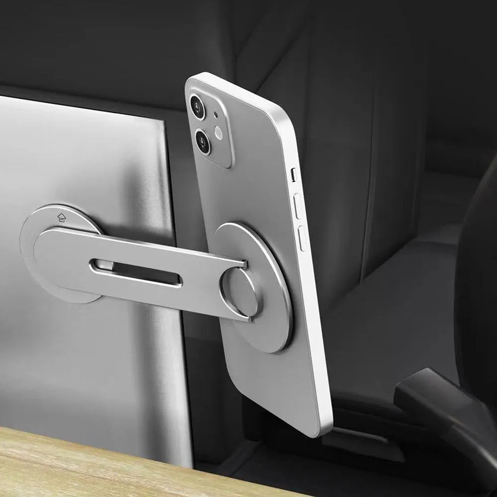 Silver magnetic phone holder for Tesla suspension screens showing 180-degree flip mechanism and aluminium alloy frame