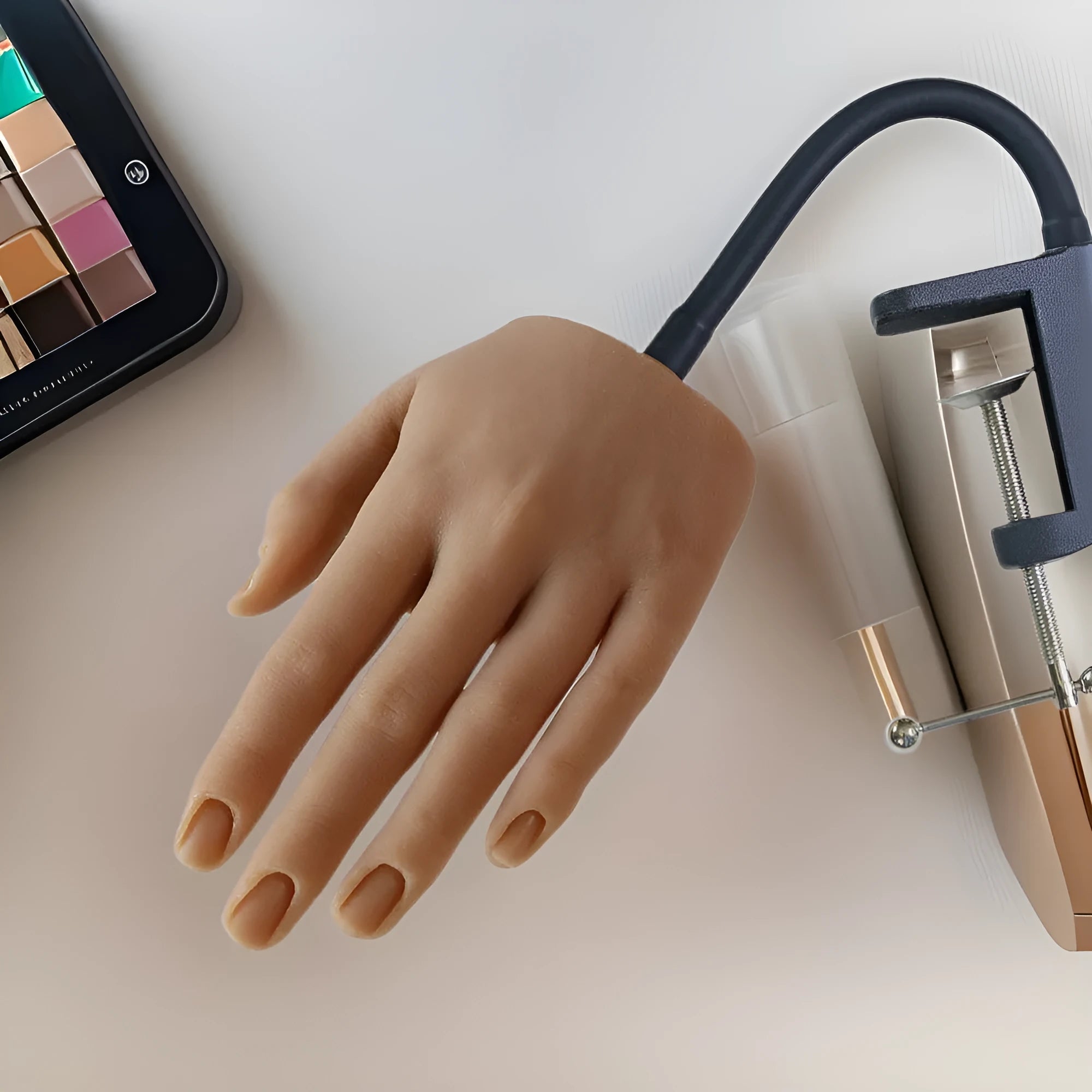 Silicone nail art practice hand model showing articulated fingers for manicure training.