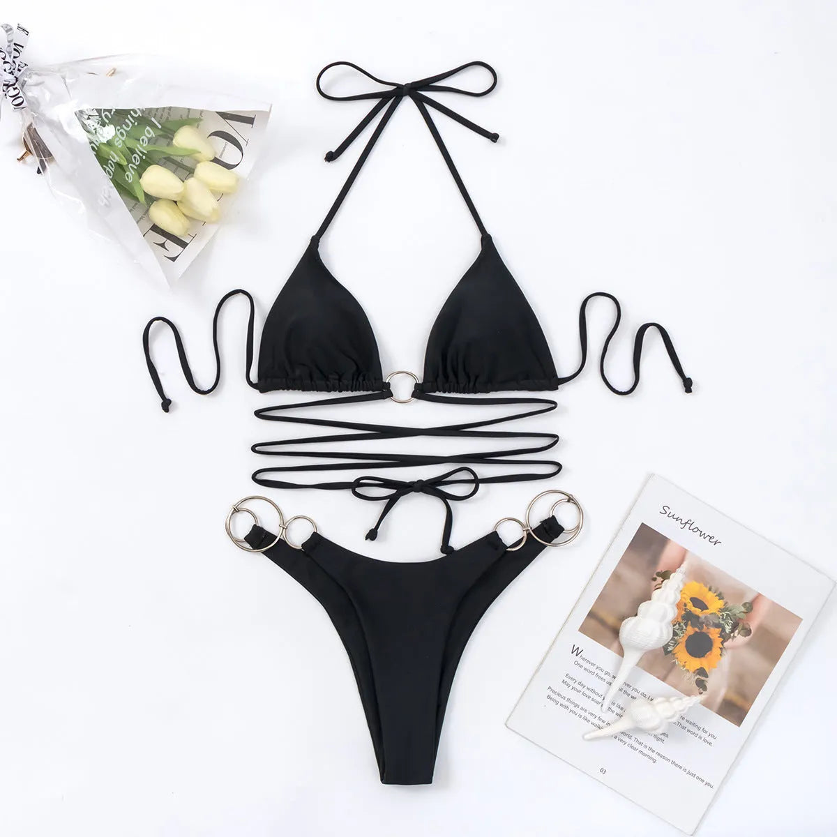Black women's bikini set with metal ring straps and backless design for swimming and fitness