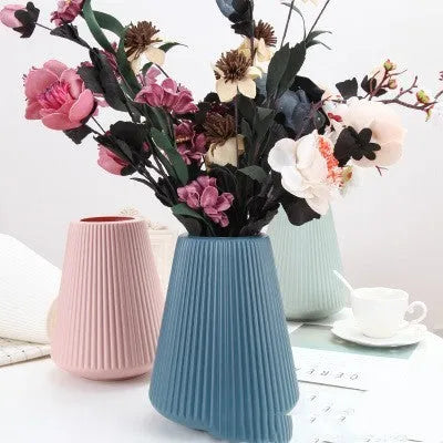Melamine plastic vase in blue colour measuring 16cm by 20cm with simple design for desktop decoration