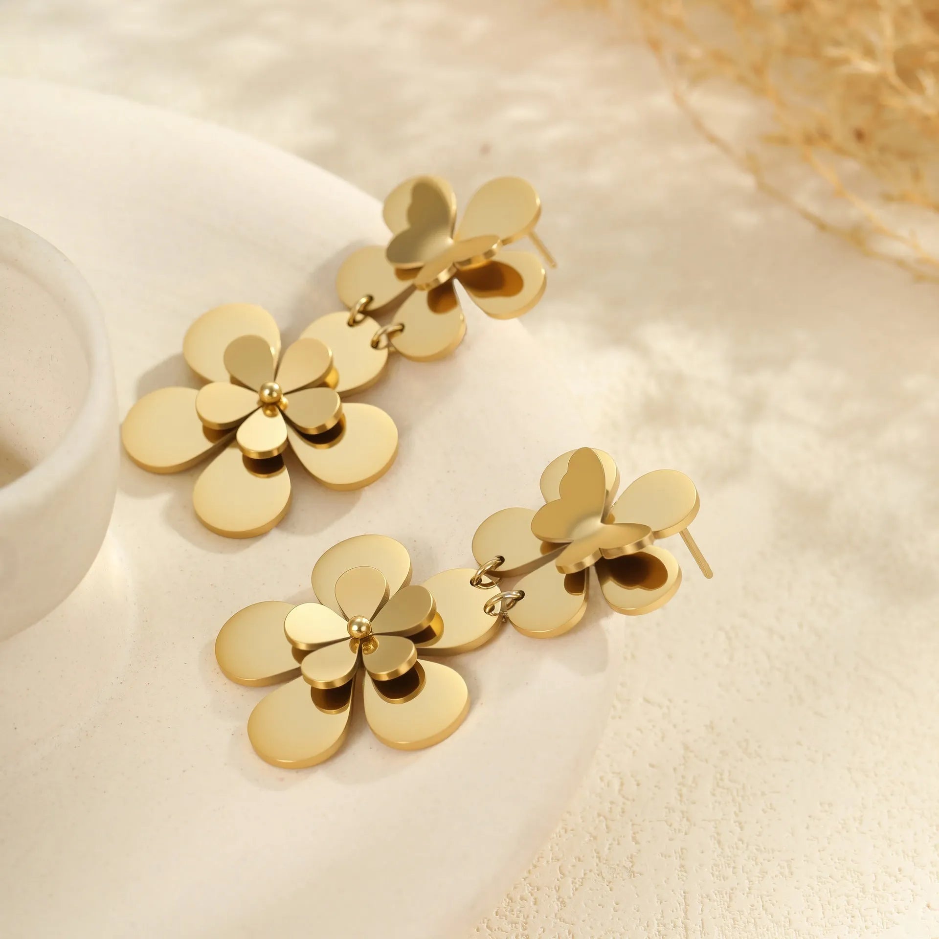 Gold-coloured stainless steel women's earrings with butterfly and flower geometric design