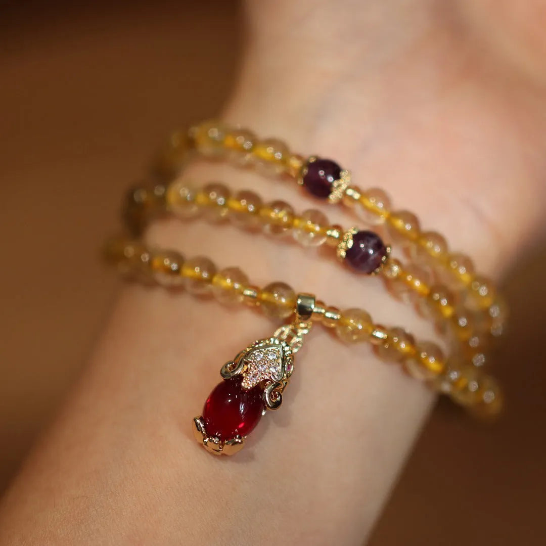 Natural Brazil gold rutilated quartz bracelet with three gold circles and ruby accents in Chinese-style design