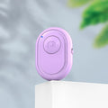 Bluetooth remote control for smartphones with self-timer, showing black, pink and purple colour options