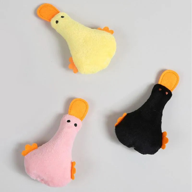 Soft plush duck toy in yellow with black details, shown with a cat and dog, highlighting its catnip filling and squeaker.
