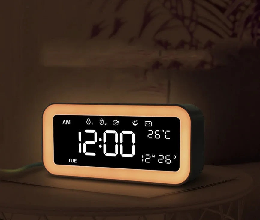 Rectangular LED atmosphere alarm clock in blue or pink with digital display and music function