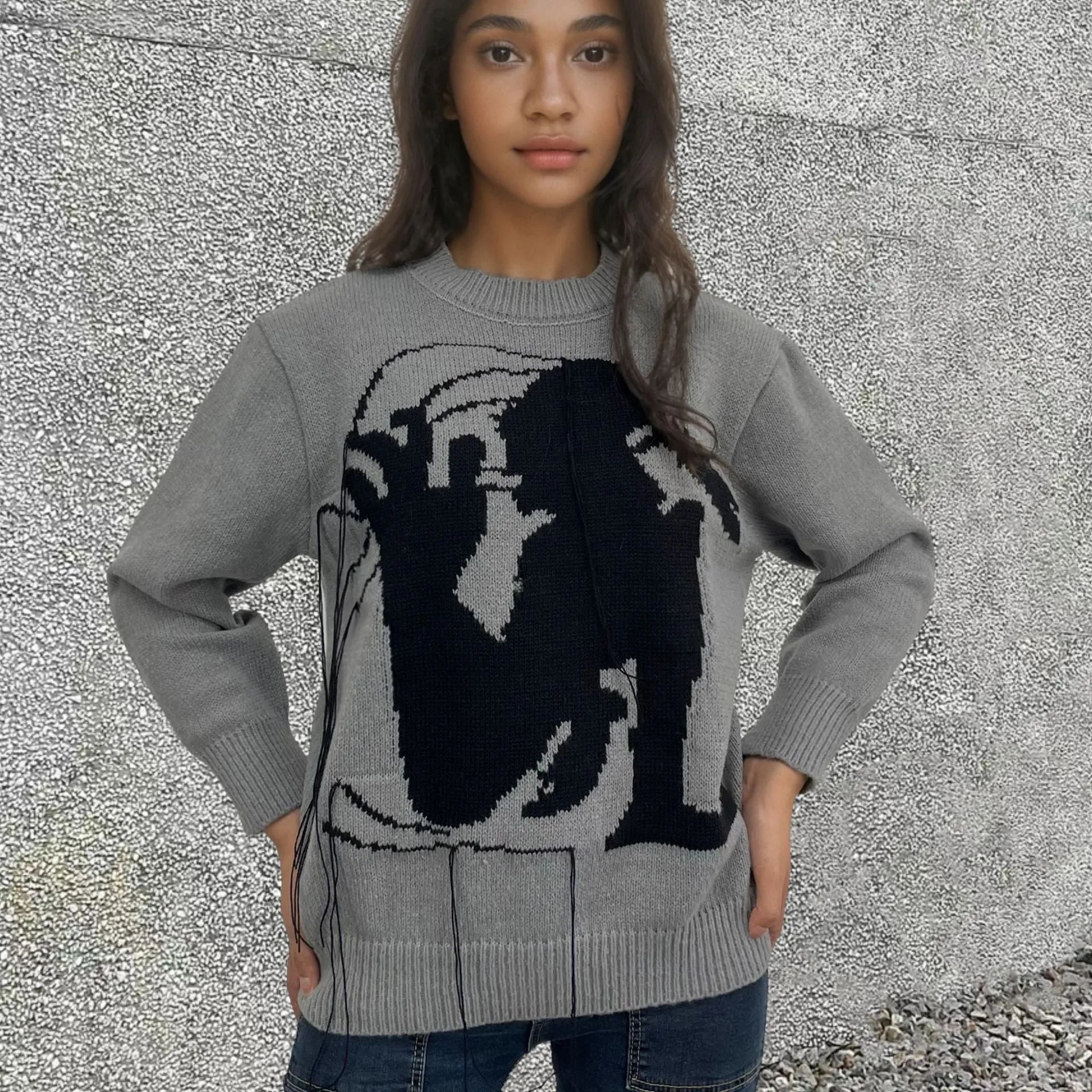 Grey women's alpaca wool pullover sweater with abstract pattern and tassel detail, loose street fashion fit.