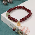 Women's purple gold sand cinnabar bracelet with fu character and peach blossom design on adjustable band