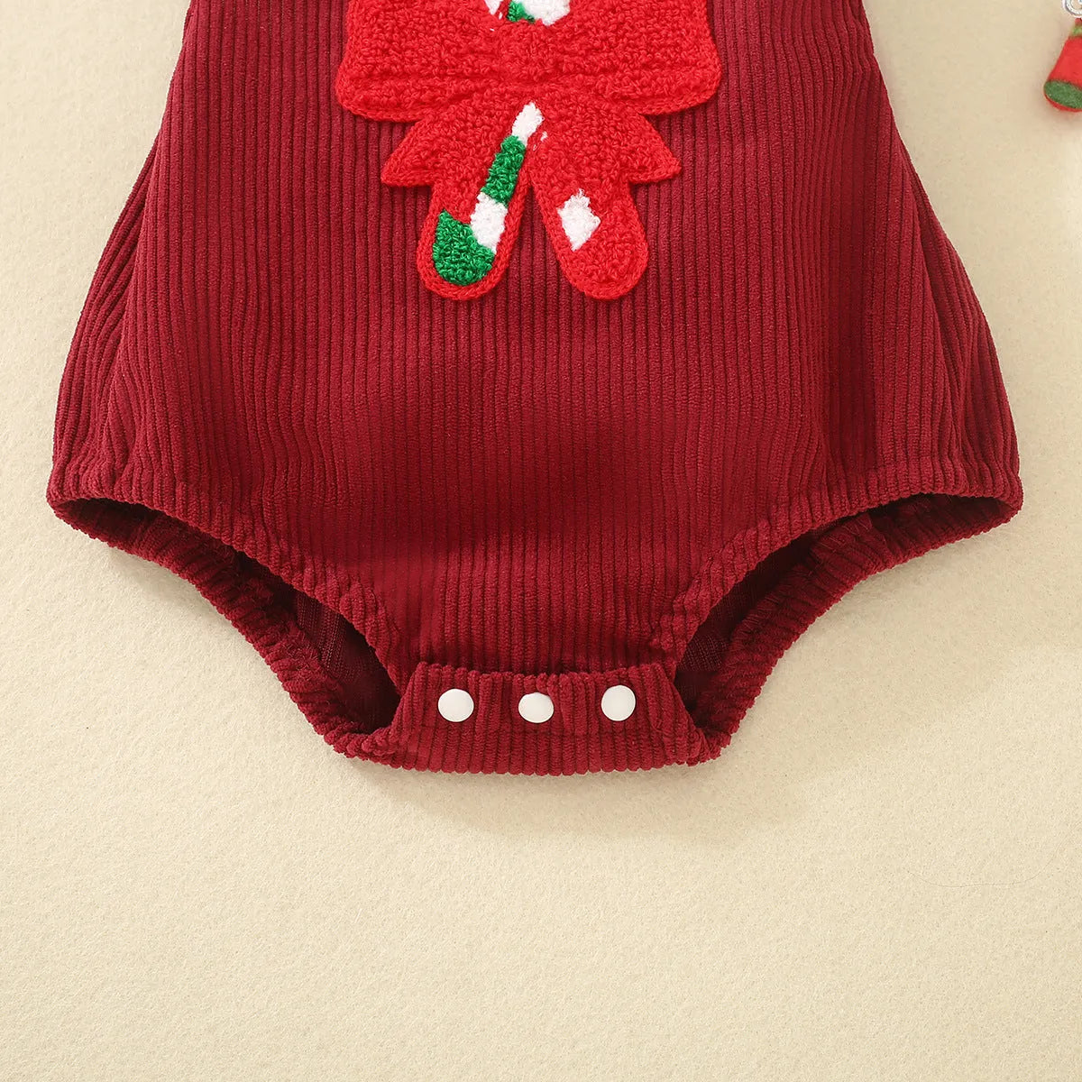 Red sleeveless cotton triangle romper for babies and toddlers with embroidered wing detail, shown in 70cm to 100cm sizes