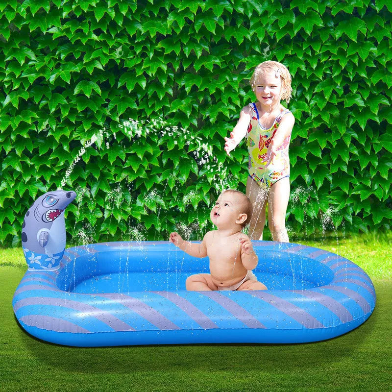 Blue dinosaur-themed inflatable water spray pool for kids in a garden