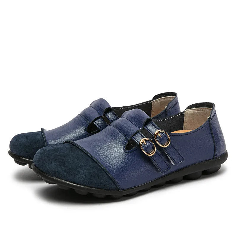 Casual black flat shoes with Velcro strap and round toe on a beef tendon sole.