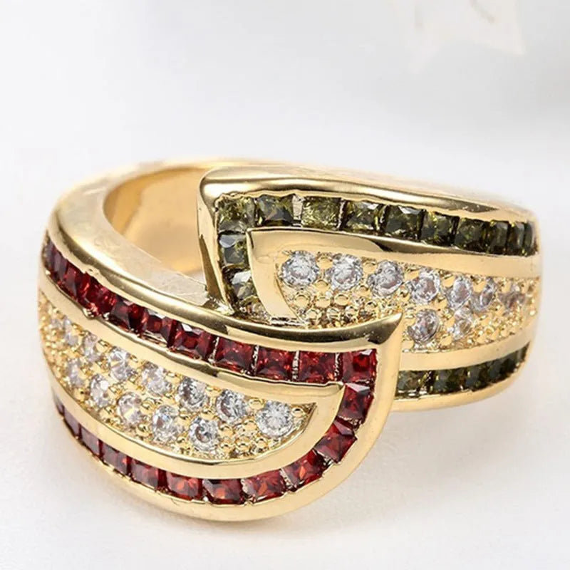 Gold-coloured women's alloy ring with a central green peridot stone on a model's finger.