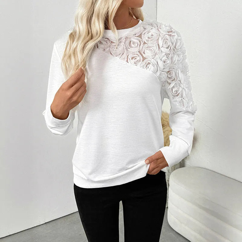 Long sleeve white top with floral pattern in loose pullover style, sizes S to XL