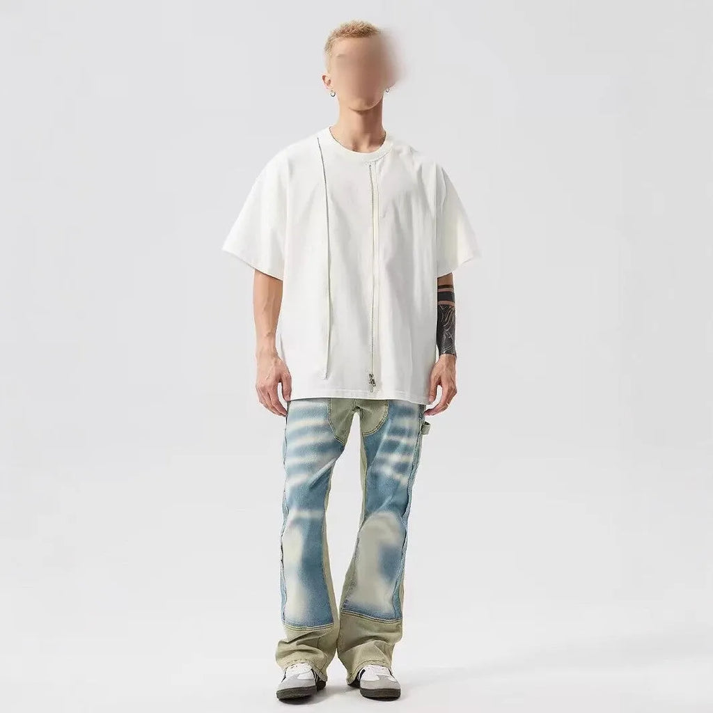 Retro dual-colour patchwork jeans with yellow and blue sections, splash-ink patterns, and distressed detailing on mid-waist denim trousers