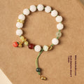 Hand-woven white jade Bodhi bracelet with lucky persimmon charm and three bead sizes on open rope